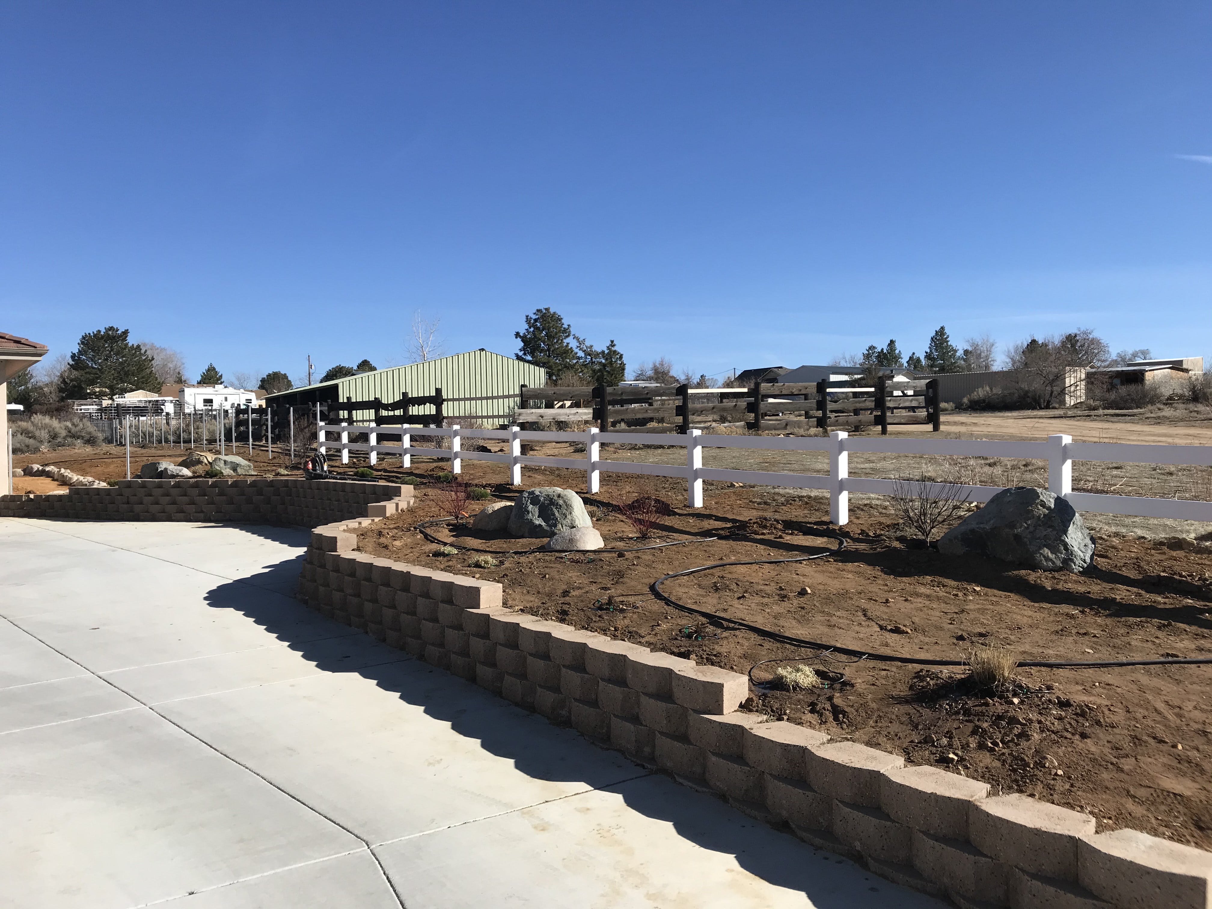 picture of white wooden ranch fencing outdoors