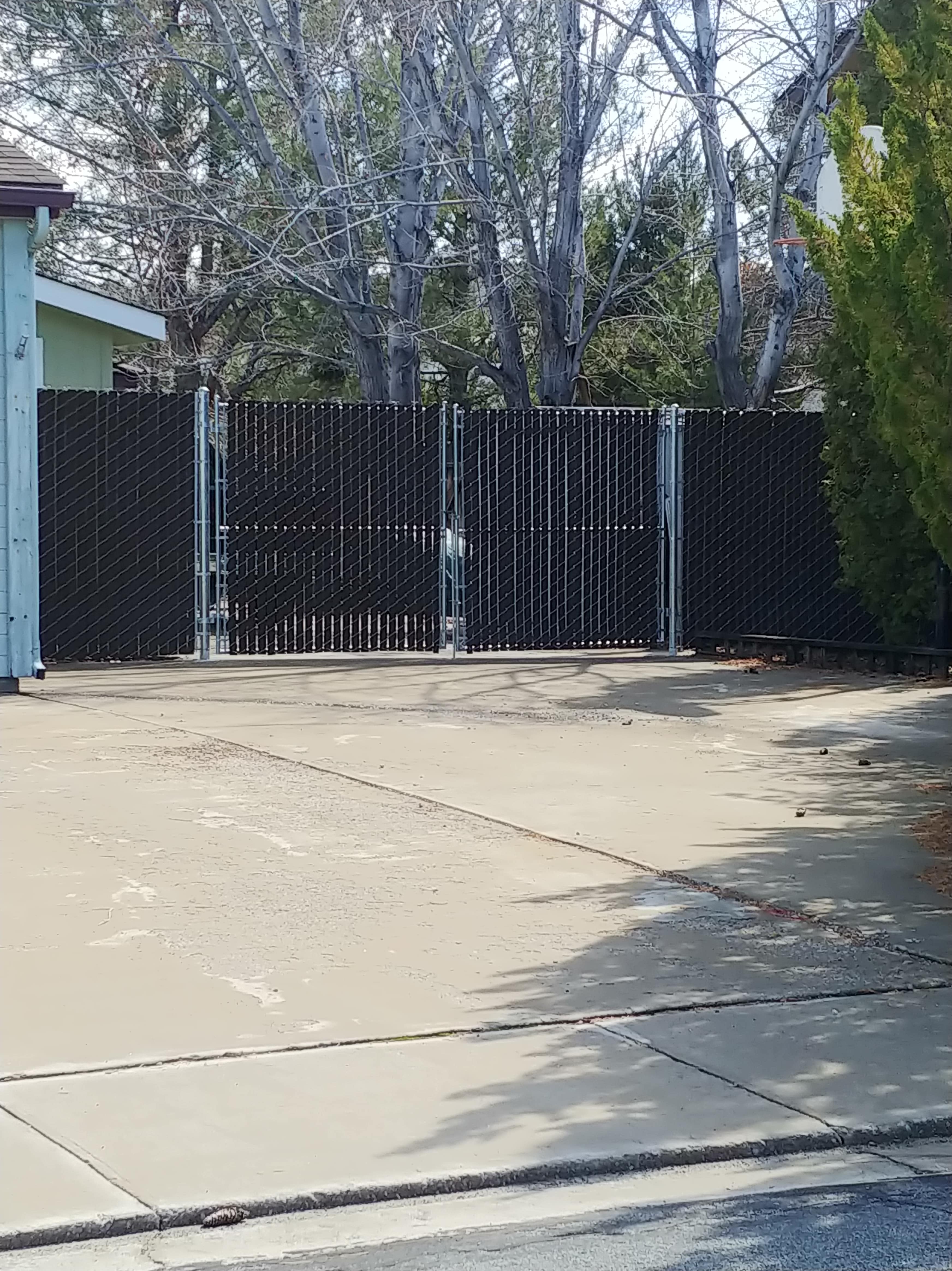 picture of slatted chain link fence outside